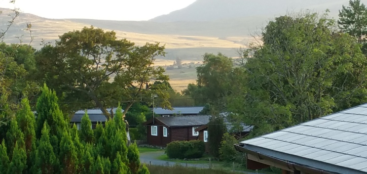 Another view across the log cabin village to the mountains